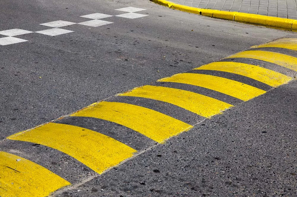 Road Speed Bump with Yellow Lines
